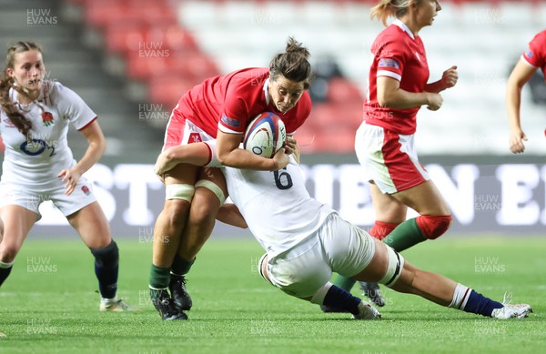 140922 - England Women v Wales Women, Women’s Rugby World Cup Warm-up Match - Sioned Harries of Wales is tackled by Alex Matthews of England