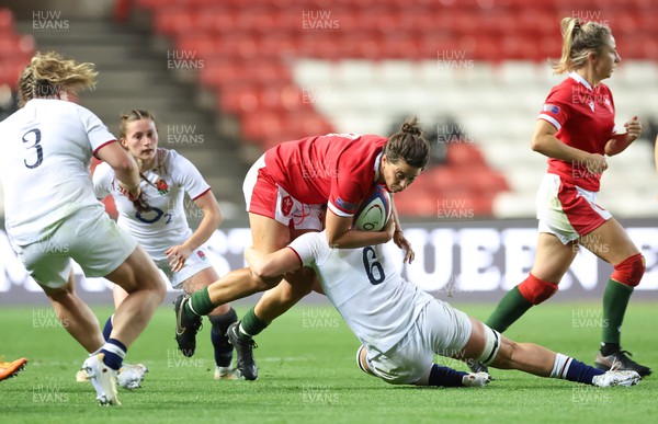 140922 - England Women v Wales Women, Women’s Rugby World Cup Warm-up Match - Sioned Harries of Wales is tackled by Alex Matthews of England