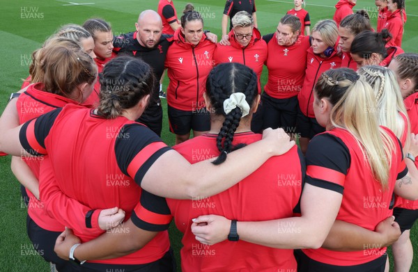 140922 - England Women v Wales Women, Women’s Rugby World Cup Warm-up Match - Richard Whiffin speaks to the players as the Wales Women squad huddle up ahead of the match