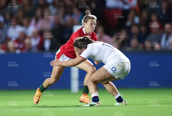 140922 - England Women v Wales Women, Women’s Rugby World Cup Warm-up Match - Keira Bevan of Wales takes on Helena Rowland of England