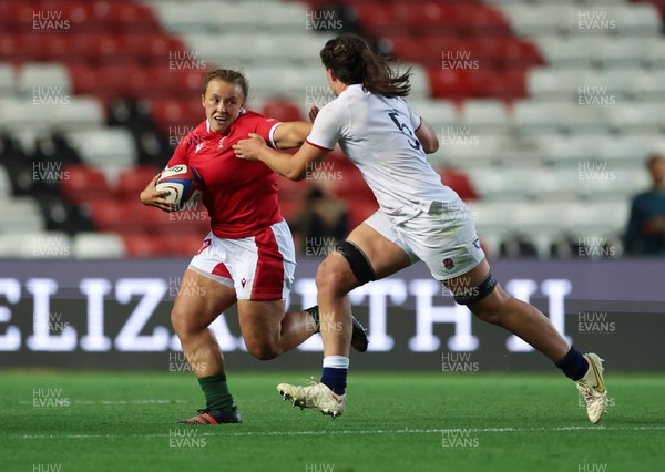 140922 - England Women v Wales Women, Women’s Rugby World Cup Warm-up Match - Lleucu George of Wales looks to hold off Abbie Ward of England