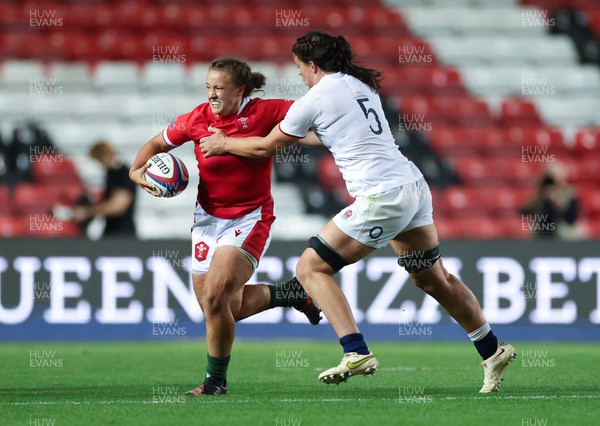 140922 - England Women v Wales Women, Women’s Rugby World Cup Warm-up Match - Lleucu George of Wales looks to hold off Abbie Ward of England