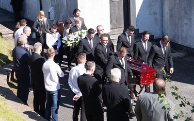 280918 - Enzo Calzaghe Funeral, Newbridge, South Wales - Former World Champion boxer Joe Calzaghe, right, leads the coffin out of the church at the funeral of his father and boxing trainer Enzo Calzaghe