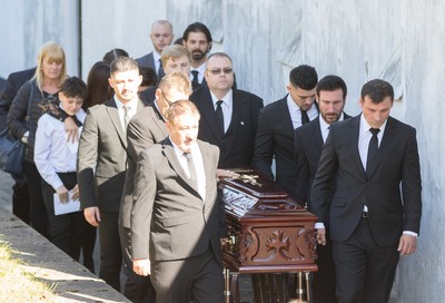 280918 - Enzo Calzaghe Funeral, Newbridge, South Wales - Former World Champion boxer Joe Calzaghe, right, leads the coffin out of the church at the funeral of his father and boxing trainer Enzo Calzaghe