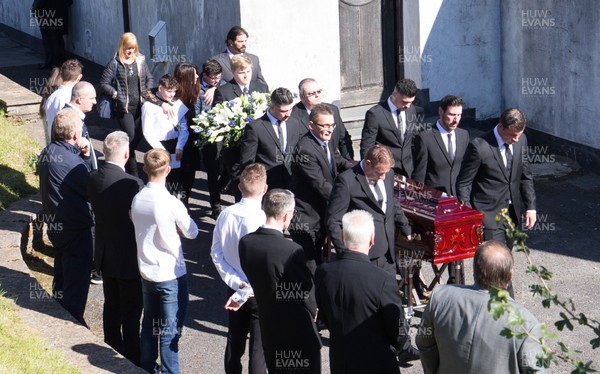 280918 - Enzo Calzaghe Funeral, Newbridge, South Wales - Former World Champion boxer Joe Calzaghe, right, leads the coffin out of the church at the funeral of his father and boxing trainer Enzo Calzaghe