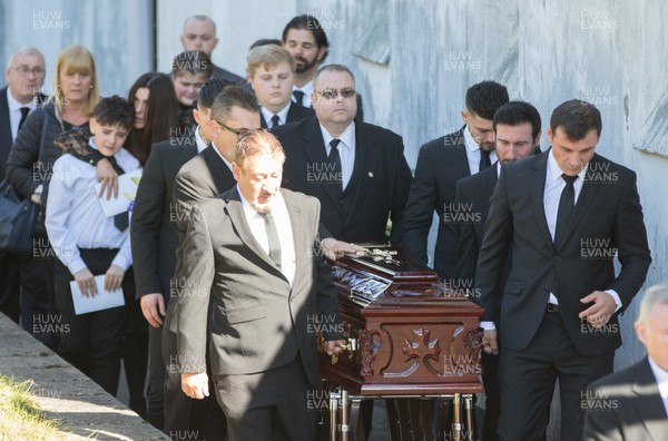 280918 - Enzo Calzaghe Funeral, Newbridge, South Wales - Former World Champion boxer Joe Calzaghe, right, leads the coffin out of the church at the funeral of his father and boxing trainer Enzo Calzaghe