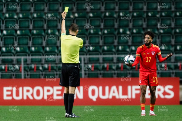 111021 - Estonia & Wales - Group E 2022 FIFA World Cup European Qualifier - Wales' Sorba Thomas is shown the yellow card by referee Sandro Scharer