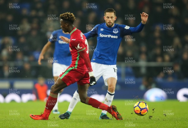 181217 - Everton v Swansea City, Premier League - Tammy Abraham of Swansea City and Gylfi Sigurdsson of Everton compete for the ball