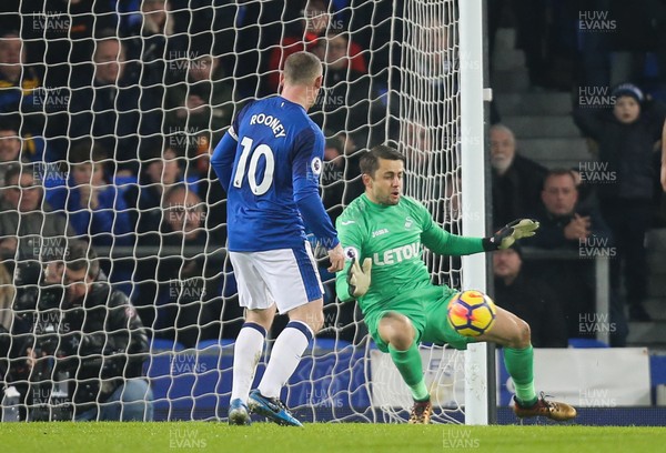 181217 - Everton v Swansea City, Premier League - Swansea City goalkeeper Lukasz Fabianski is beaten by  a shot from Dominic Calvert-Lewin of Everton after the saves the penalty from Wayne Rooney of Everton