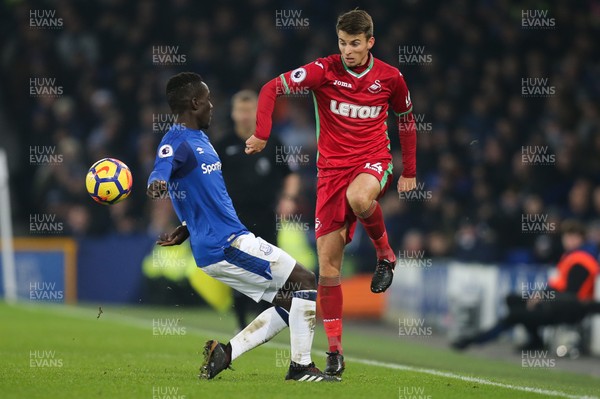 181217 - Everton v Swansea City, Premier League - Tom Carroll of Swansea City is challenged by Idrissa Gueye of Everton