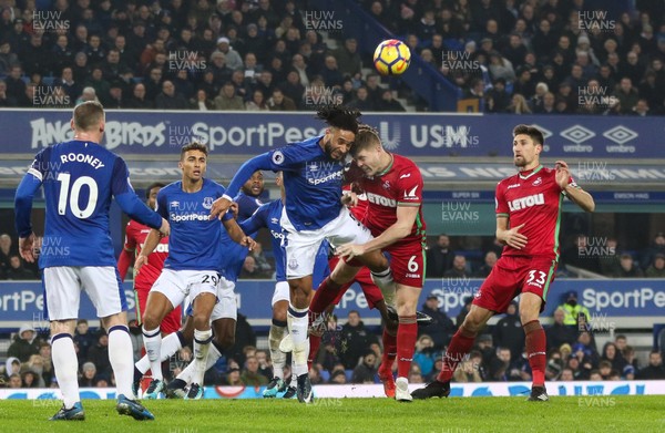 181217 - Everton v Swansea City, Premier League - Alfie Mawson of Swansea City and Ashley Williams of Everton compete to win the ball