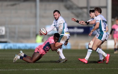 150225 - Exeter Chiefs v Gloucester Rugby - Premiership Cup Pool E - George McGuigan of Gloucester is tackled by Paul Brown-Bampoe of Exeter 