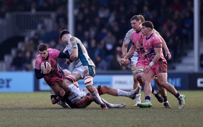 150225 - Exeter Chiefs v Gloucester Rugby - Premiership Cup Pool E - Joe Hawkins of Exeter is tackled by Cam Jordan of Gloucester 