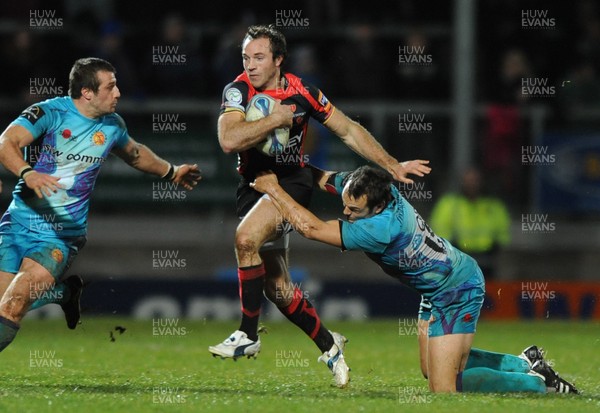 11.12.11 - Exeter Chiefs v Newport-Gwent Dragons - Amlin Challenge Cup - Will Harries of Newport-Gwent Dragons is tackled by Nic Sestaret and Phil Dollman of Exeter. 