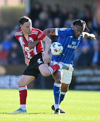 140326 - Exeter City v Cardiff City - Sky Bet League 1 - Jayden Wareham of Exeter City battles for possession with Gabriel Osho of Cardiff City 