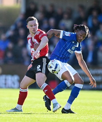 140326 - Exeter City v Cardiff City - Sky Bet League 1 - Jayden Wareham of Exeter City battles for possession with Gabriel Osho of Cardiff City 