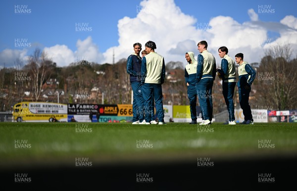 140326 - Exeter City v Cardiff City - Sky Bet League 1 - Players of Cardiff City walk the pitch ahead of kick off 