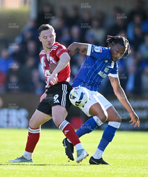 140326 - Exeter City v Cardiff City - Sky Bet League 1 - Jayden Wareham of Exeter City battles for possession with Gabriel Osho of Cardiff City 