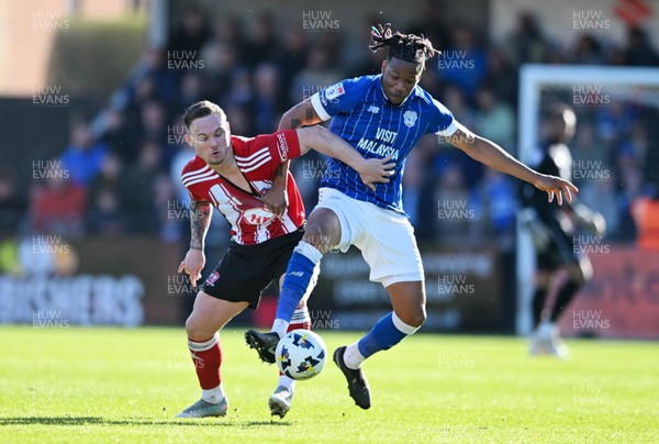 140326 - Exeter City v Cardiff City - Sky Bet League 1 - Jayden Wareham of Exeter City battles for possession with Gabriel Osho of Cardiff City 