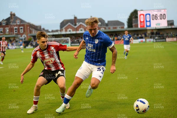 160925 - Exeter City v Cardiff City - Vertu Trophy - Isaak Davies of Cardiff City is challenged by Liam Oakes of Exeter