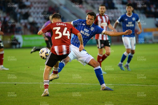 160925 - Exeter City v Cardiff City - Vertu Trophy - Perry NG of Cardiff City is challenged by Liam Oakes of Exeter