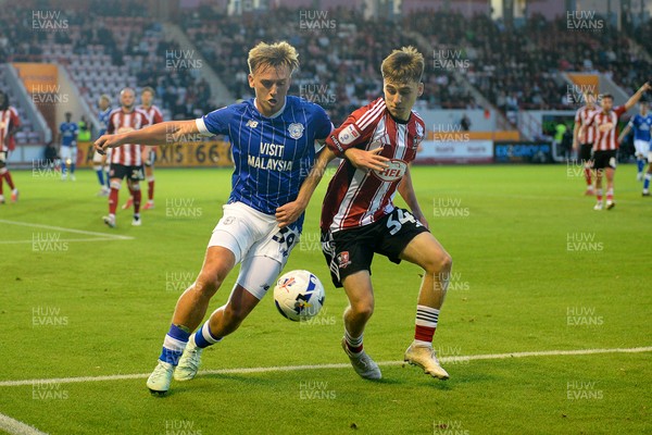 160925 - Exeter City v Cardiff City - Vertu Trophy - Isaak Davies of Cardiff City is challenged by Liam Oakes of Exeter