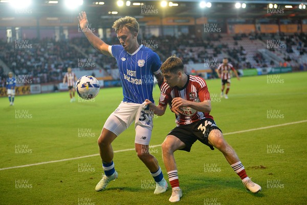 160925 - Exeter City v Cardiff City - Vertu Trophy - Isaak Davies of Cardiff City is challenged by Liam Oakes of Exeter