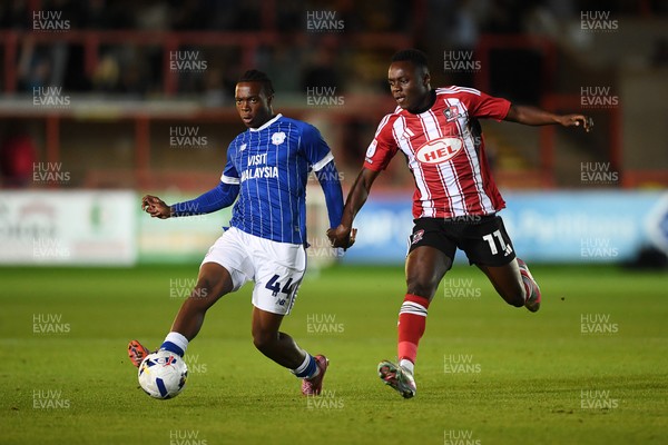 160925 - Exeter City v Cardiff City - Vertu Trophy - Ronan Kpakio of Cardiff City is challenged by Andrew Oluwabori of Exeter
