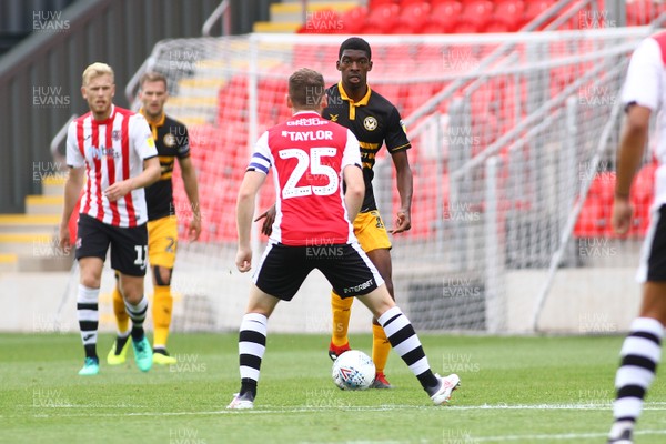 180818 - Exeter City v Newport County - EFL SkyBet League 2 - Tyreeq Bakinson of Newport County takes on Jake Taylor of Exeter City 