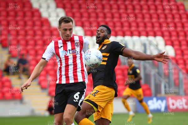 180818 - Exeter City v Newport County - EFL SkyBet League 2 - Jamille Matt of Newport County and Lee Holmes of Exeter City battle for the ball 