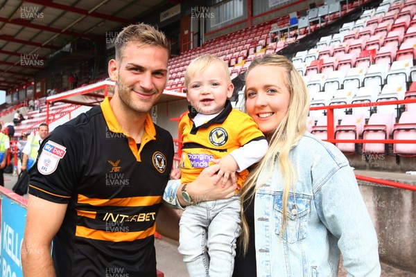 180818 - Exeter City v Newport County - EFL SkyBet League 2 - Mickey Demetriou of Newport County celebrates the result with wife Aimee and 11 month old son Theo at the end of the game  