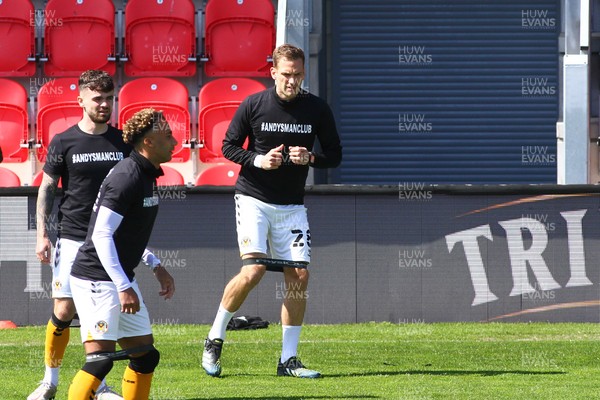 240421 - Exeter City v Newport County - Sky Bet League 2 - Micky Demetriou of Newport County warms up before kick off 
