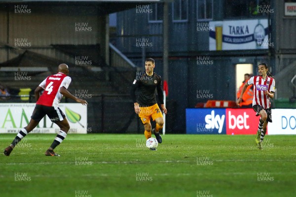 261219 - Exeter City v Newport County - EFL SkyBet League 2 - Micky Demetriou of Newport County tries to run the ball out of defence 