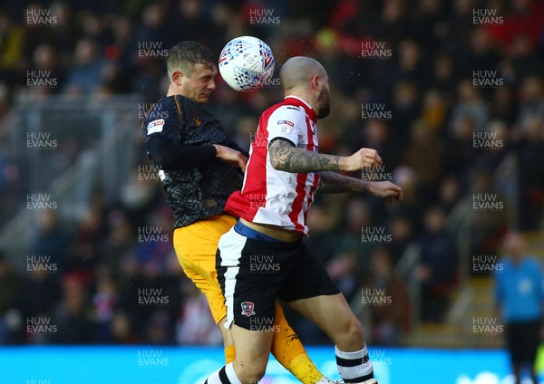 261219 - Exeter City v Newport County - EFL SkyBet League 2 - Taylor Malony of Newport County challenges Nicky Law of Exeter City for a high ball 