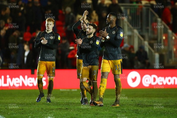 261219 - Exeter City v Newport County - EFL SkyBet League 2 - Ryan Haynes Micky Demetriou Josh Sheehan and Jamille Matt of Newport County applaud the traveling fans at the end of the game 