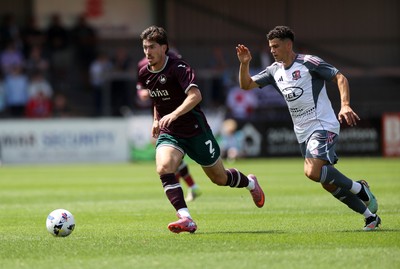 260725 - Exeter City v Swansea City - Pre Season Friendly - Josh Key of Swansea is challenged by Sonny Cox of Exeter 