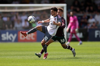 260725 - Exeter City v Swansea City - Pre Season Friendly - Jack Aitchison of Exeter is challenged by Ethan Galbraith of Swansea 