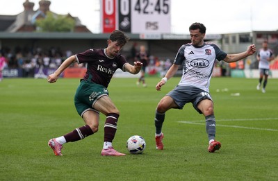 260725 - Exeter City v Swansea City - Pre Season Friendly - Josh Key of Swansea is challenged by Jack Aitchison of Exeter 