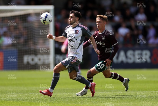 260725 - Exeter City v Swansea City - Pre Season Friendly - Jack Aitchison of Exeter is challenged by Ethan Galbraith of Swansea 