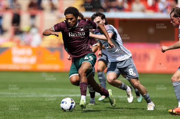 260725 - Exeter City v Swansea City - Pre Season Friendly - Kyrell Wilson of Swansea makes a break