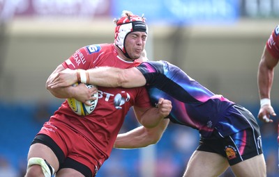 130816 - Exeter Chiefs v Scarlets - Preseason Friendly -Will Boyde of Scarlets is tackled by James Short of Exeter