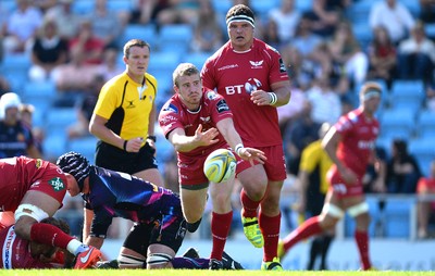 130816 - Exeter Chiefs v Scarlets - Preseason Friendly -Jonathan Evans of Scarlets gets the ball away