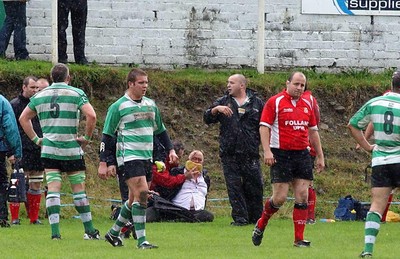 Collect pic  Spectator fights with rugby player. Cwmavon supporter recieved medical attention on the touch-line after he attacked Tonmawr lock Mervyn Meredith who had been yellow carded.  