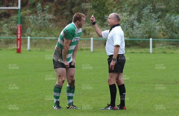 Collect pic  Spectator fights with rugby player. Mervyn Meredith is yellow carded by referee Michael Cox sparking violence from the touchline..   