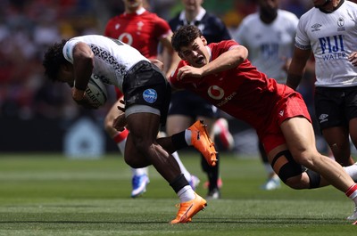 040726 - Fiji v Wales - Nations Championship - Isaiah Armstrong-Ravula of Fiji is tackled by Eddie James of Wales 