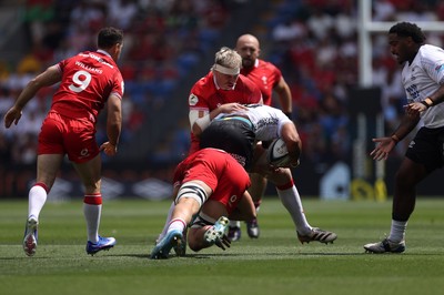 040726 - Fiji v Wales - Nations Championship - Isaiah Armstrong-Ravula of Fiji is tackled by Aaron Wainwright of Wales 