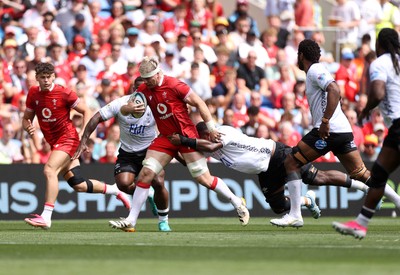 040726 - Fiji v Wales - Nations Championship - Aaron Wainwright of Wales is tackled by Temo Mayanavanua of Fiji 