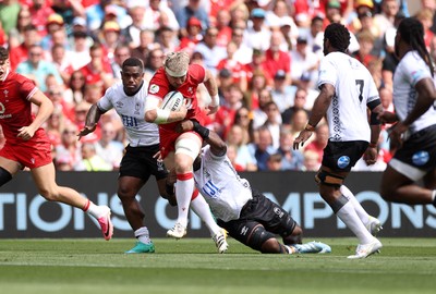 040726 - Fiji v Wales - Nations Championship - Aaron Wainwright of Wales is tackled by Temo Mayanavanua of Fiji 