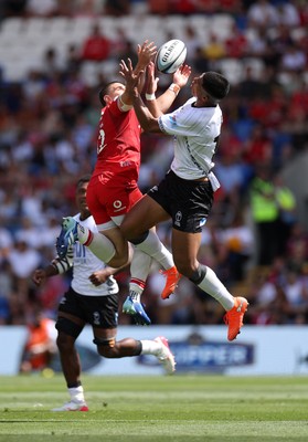040726 - Fiji v Wales - Nations Championship - Joe Hawkins of Wales goes up for the ball with Salesi Rayasi of Fiji 