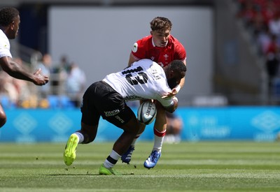 040726 - Fiji v Wales - Nations Championship - Dan Edwards of Wales is tackled by Semi Radradra of Fiji 